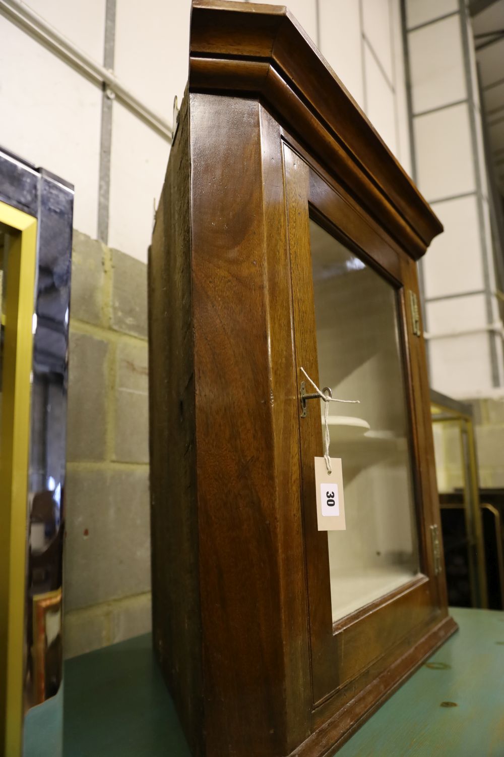 A mahogany hanging corner cabinet, width 68cm, depth 40cm, height 70cm